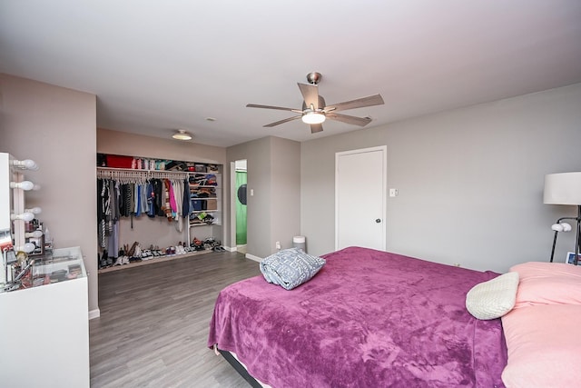 19923 Ricewood Way, Katy, TX 77449 - bedroom with a closet, wood finished floors, and ceiling fan
