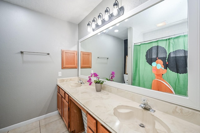 19923 Ricewood Way, Katy, TX 77449 - bathroom featuring double vanity, tile patterned flooring, and curtained shower