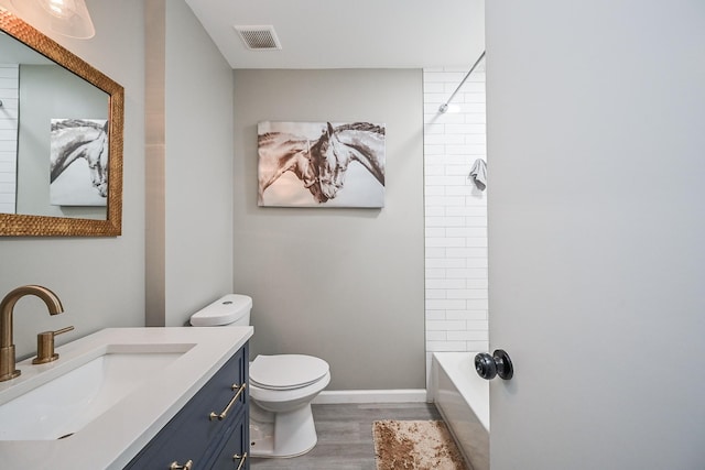 19923 Ricewood Way, Katy, TX 77449 - bathroom with wood finished floors, vanity, and bathtub / shower combination