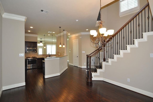 5325 Petty St Unit B, Houston, TX 77007 - kitchen with stainless steel appliances, a chandelier, ornamental molding, dark wood-style flooring, and recessed lighting