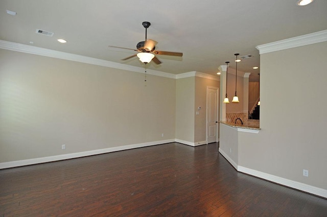 5325 Petty St Unit B, Houston, TX 77007 - unfurnished living room featuring a ceiling fan, ornamental molding, dark wood-type flooring, and recessed lighting