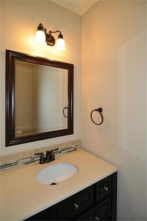 5325 Petty St Unit B, Houston, TX 77007 - bathroom featuring vanity and ornamental molding