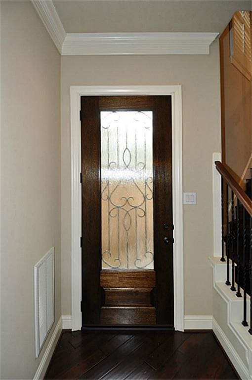 5325 Petty St Unit B, Houston, TX 77007 - entrance foyer featuring crown molding, dark wood-style flooring, and stairway