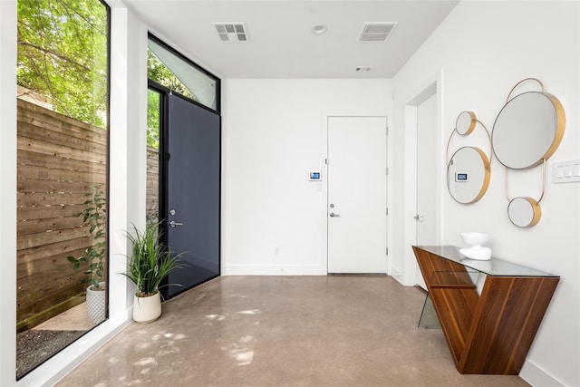 509 W Drew St, Houston, TX 77006 - foyer with concrete floors and baseboards