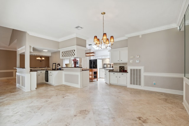 6606 Preston Trail Dr, Houston, TX 77069 - kitchen with a chandelier, dark countertops, a peninsula, white cabinets, and ornamental molding
