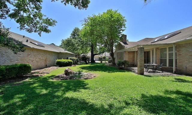 6606 Preston Trail Dr, Houston, TX 77069 - view of green lawn featuring a patio