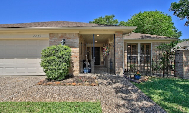 6606 Preston Trail Dr, Houston, TX 77069 - property entrance with an attached garage and roof with shingles