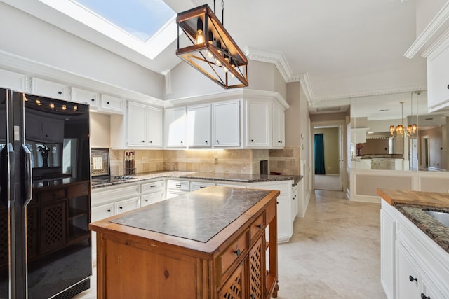 6606 Preston Trail Dr, Houston, TX 77069 - kitchen featuring refrigerator, a chandelier, decorative backsplash, white cabinets, and crown molding