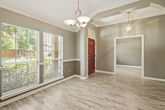 15919 Shadow Pass Trl, Tomball, TX 77377 - spare room with a chandelier, ornamental molding, wood finished floors, and arched walkways