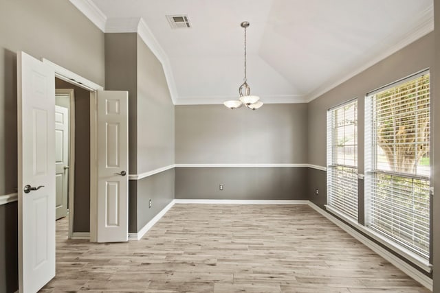 15919 Shadow Pass Trl, Tomball, TX 77377 - unfurnished room with a chandelier, light wood finished floors, crown molding, and lofted ceiling
