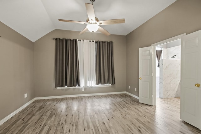 15919 Shadow Pass Trl, Tomball, TX 77377 - spare room featuring ceiling fan, wood finished floors, and vaulted ceiling
