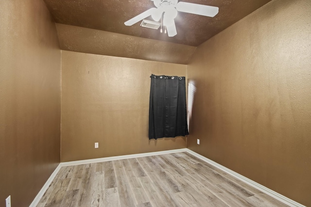 15919 Shadow Pass Trl, Tomball, TX 77377 - spare room with wood finished floors, vaulted ceiling, and ceiling fan