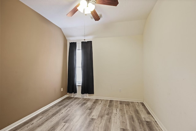 15919 Shadow Pass Trl, Tomball, TX 77377 - unfurnished room with vaulted ceiling, light wood finished floors, and a ceiling fan