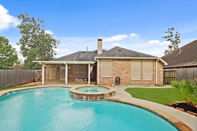 15919 Shadow Pass Trl, Tomball, TX 77377 - view of swimming pool with a fenced backyard, a pool with connected hot tub, and a patio area