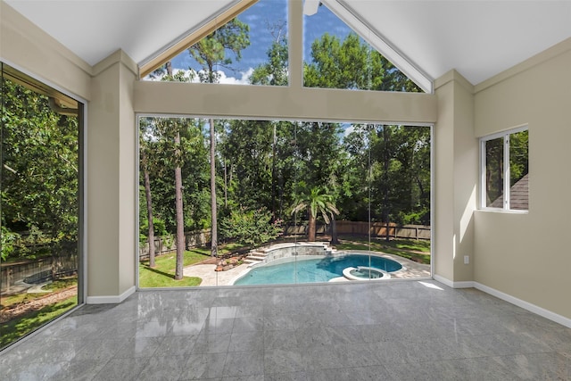 193 Grogans Point Rd, The Woodlands, TX 77380 - view of swimming pool featuring a fenced backyard, a patio area, a pool with connected hot tub, and view of wooded area