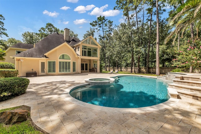 193 Grogans Point Rd, The Woodlands, TX 77380 - view of pool featuring a patio, a pool with connected hot tub, french doors, and a fenced backyard