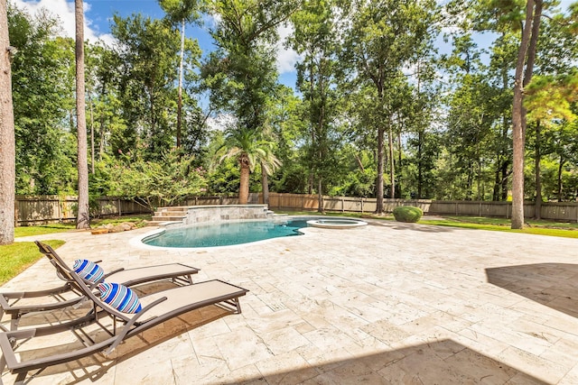 193 Grogans Point Rd, The Woodlands, TX 77380 - view of pool with a pool with connected hot tub, a patio, a fenced backyard, and view of scattered trees