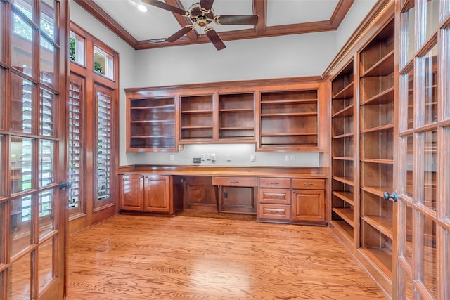 193 Grogans Point Rd, The Woodlands, TX 77380 - unfurnished office featuring light wood-type flooring, crown molding, built in desk, and a ceiling fan