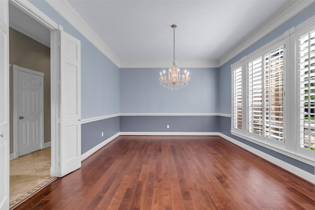 193 Grogans Point Rd, The Woodlands, TX 77380 - unfurnished room featuring a chandelier, hardwood / wood-style flooring, and crown molding
