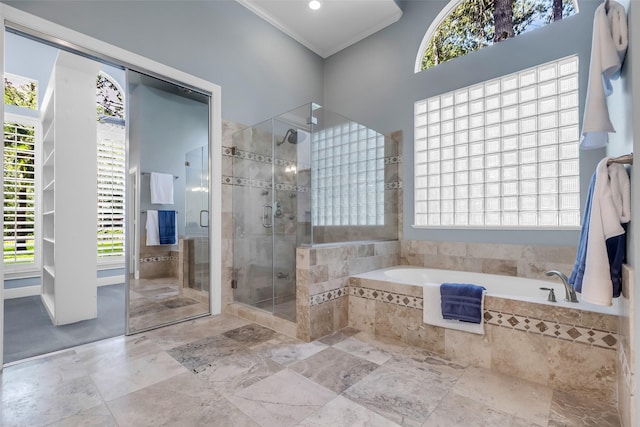 193 Grogans Point Rd, The Woodlands, TX 77380 - bathroom with a bath, a stall shower, healthy amount of natural light, and ornamental molding