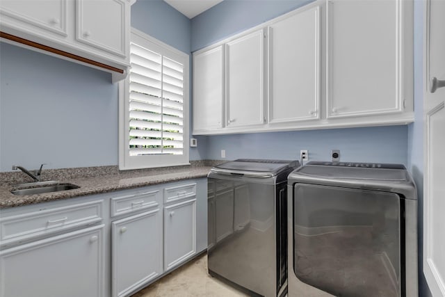 193 Grogans Point Rd, The Woodlands, TX 77380 - laundry area with cabinet space and washer and clothes dryer
