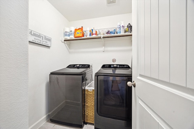 3715 Oakroc Grv, Houston, TX 77018 - washroom featuring washing machine and clothes dryer and light wood-type flooring