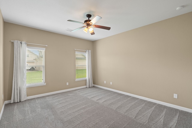 10527 Caddo Lake Dr, Needville, TX 77461 - carpeted empty room with a smoke detector and a ceiling fan