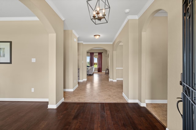 10527 Caddo Lake Dr, Needville, TX 77461 - entrance foyer with dark wood-style floors, crown molding, arched walkways, and a chandelier