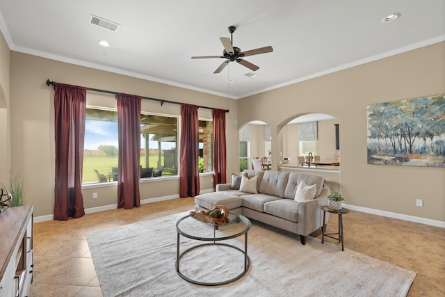 10527 Caddo Lake Dr, Needville, TX 77461 - living area with a ceiling fan, arched walkways, crown molding, recessed lighting, and light tile patterned flooring