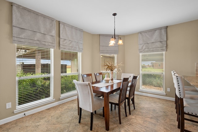 10527 Caddo Lake Dr, Needville, TX 77461 - dining space featuring a chandelier and light tile patterned floors