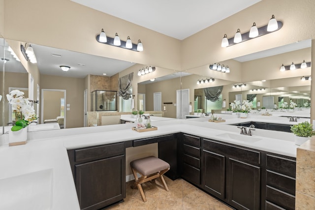 10527 Caddo Lake Dr, Needville, TX 77461 - bathroom featuring a stall shower, double vanity, and tile patterned floors
