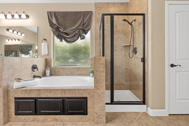 10527 Caddo Lake Dr, Needville, TX 77461 - bathroom featuring a garden tub, a stall shower, and tile patterned floors