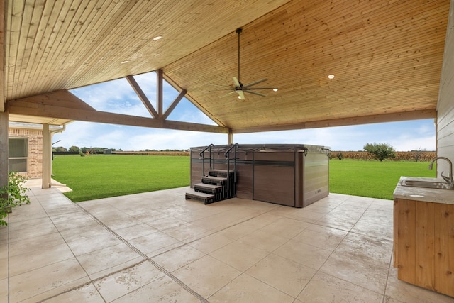 10527 Caddo Lake Dr, Needville, TX 77461 - view of patio with a hot tub and ceiling fan