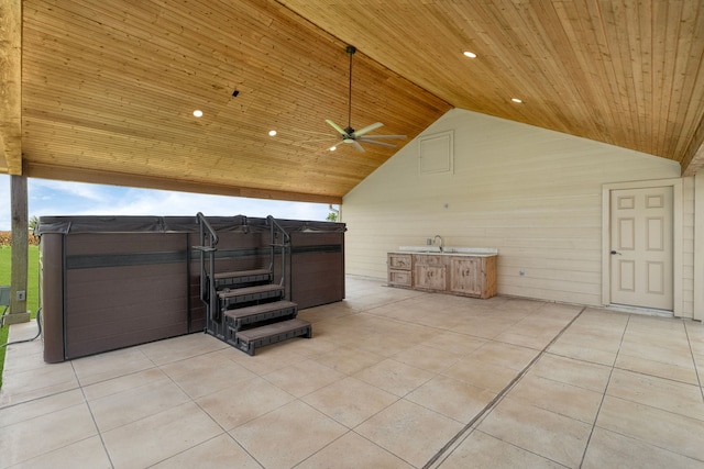 10527 Caddo Lake Dr, Needville, TX 77461 - view of patio / terrace with a hot tub, a ceiling fan, and exterior kitchen