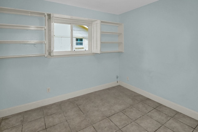 4047 Falkirk Ln, Houston, TX 77025 - tiled spare room with baseboards