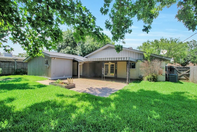 4047 Falkirk Ln, Houston, TX 77025 - back of property with french doors, a fenced backyard, and a patio