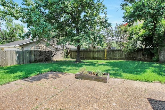 4047 Falkirk Ln, Houston, TX 77025 - fenced backyard featuring a garden and a patio