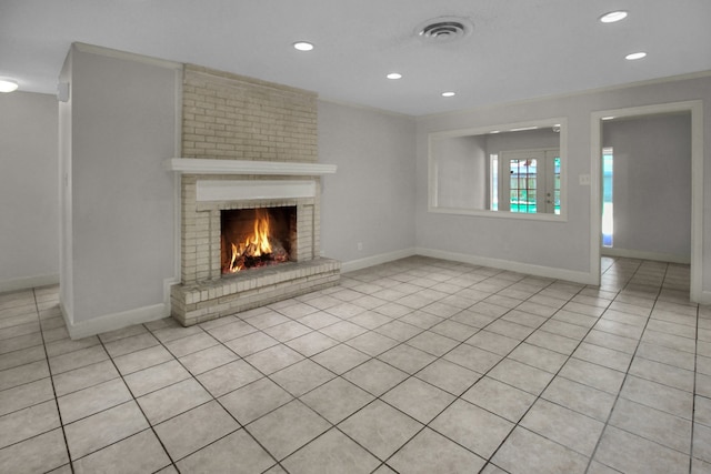 4047 Falkirk Ln, Houston, TX 77025 - unfurnished living room featuring recessed lighting, light tile patterned floors, and a fireplace