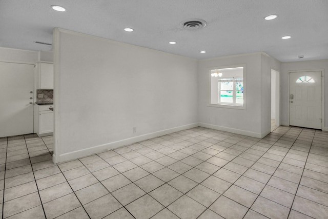 4047 Falkirk Ln, Houston, TX 77025 - entryway with recessed lighting and light tile patterned floors
