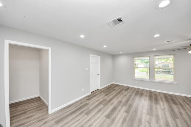 5634 Beldart St, Houston, TX 77033 - empty room featuring wood finished floors, a ceiling fan, and recessed lighting