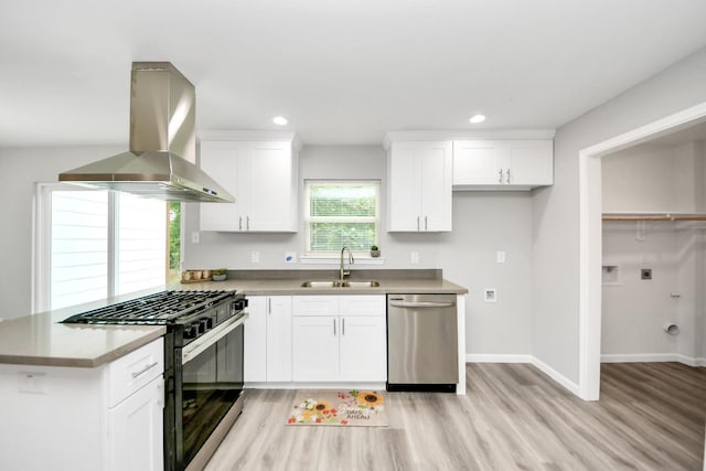 5634 Beldart St, Houston, TX 77033 - kitchen featuring dishwasher, gas range, range hood, light wood finished floors, and white cabinetry