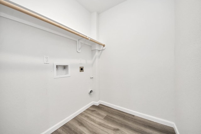 5634 Beldart St, Houston, TX 77033 - laundry area featuring electric dryer hookup, dark wood-style floors, and hookup for a washing machine