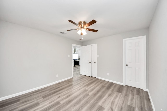 5634 Beldart St, Houston, TX 77033 - unfurnished bedroom with wood finished floors and a ceiling fan