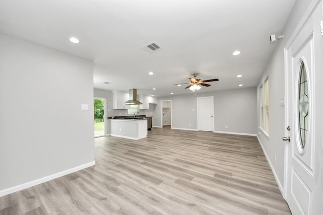 5634 Beldart St, Houston, TX 77033 - unfurnished living room featuring recessed lighting, ceiling fan, and light wood-type flooring