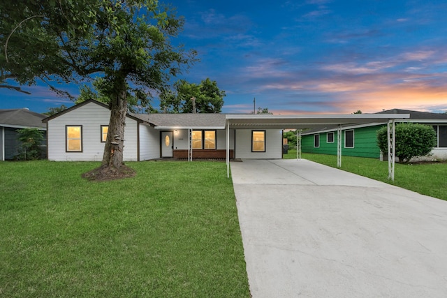 5634 Beldart St, Houston, TX 77033 - ranch-style home featuring driveway, a lawn, and an attached carport