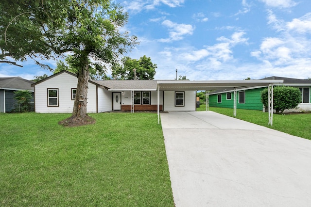 5634 Beldart St, Houston, TX 77033 - single story home featuring a front lawn, driveway, and an attached carport