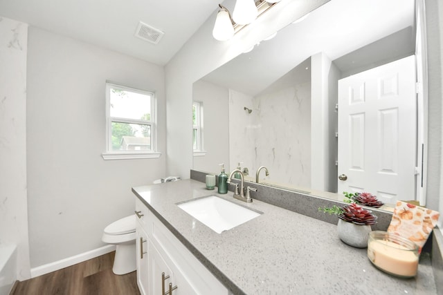 5634 Beldart St, Houston, TX 77033 - full bathroom with vanity, a shower, wood finished floors, and a bath