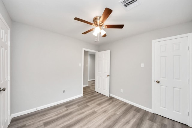 5634 Beldart St, Houston, TX 77033 - unfurnished bedroom featuring wood finished floors and ceiling fan