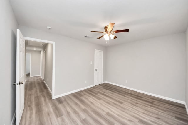 5634 Beldart St, Houston, TX 77033 - unfurnished room featuring attic access, ceiling fan, light wood finished floors, and a smoke detector