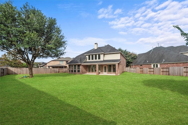 4403 Lodge Vine Ct, Sugar Land, TX 77479 - back of property featuring a fenced backyard, brick siding, and a patio area